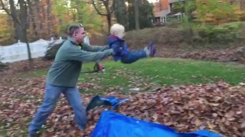 "A Tot Boy Experiences His Very First Leaf Pile"