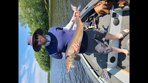 Catching a sturgeon while fishing