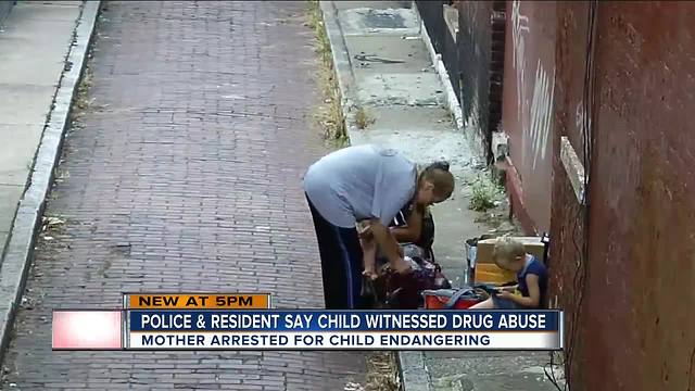 PD: Woman used drugs in alley with child present