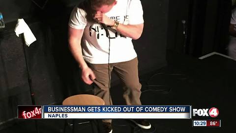 business man gets kicked out of comedy show