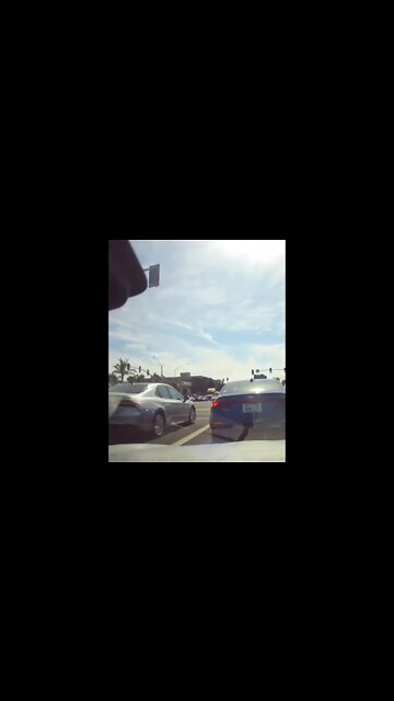 Pedestrian Walks In Front Of Traffic