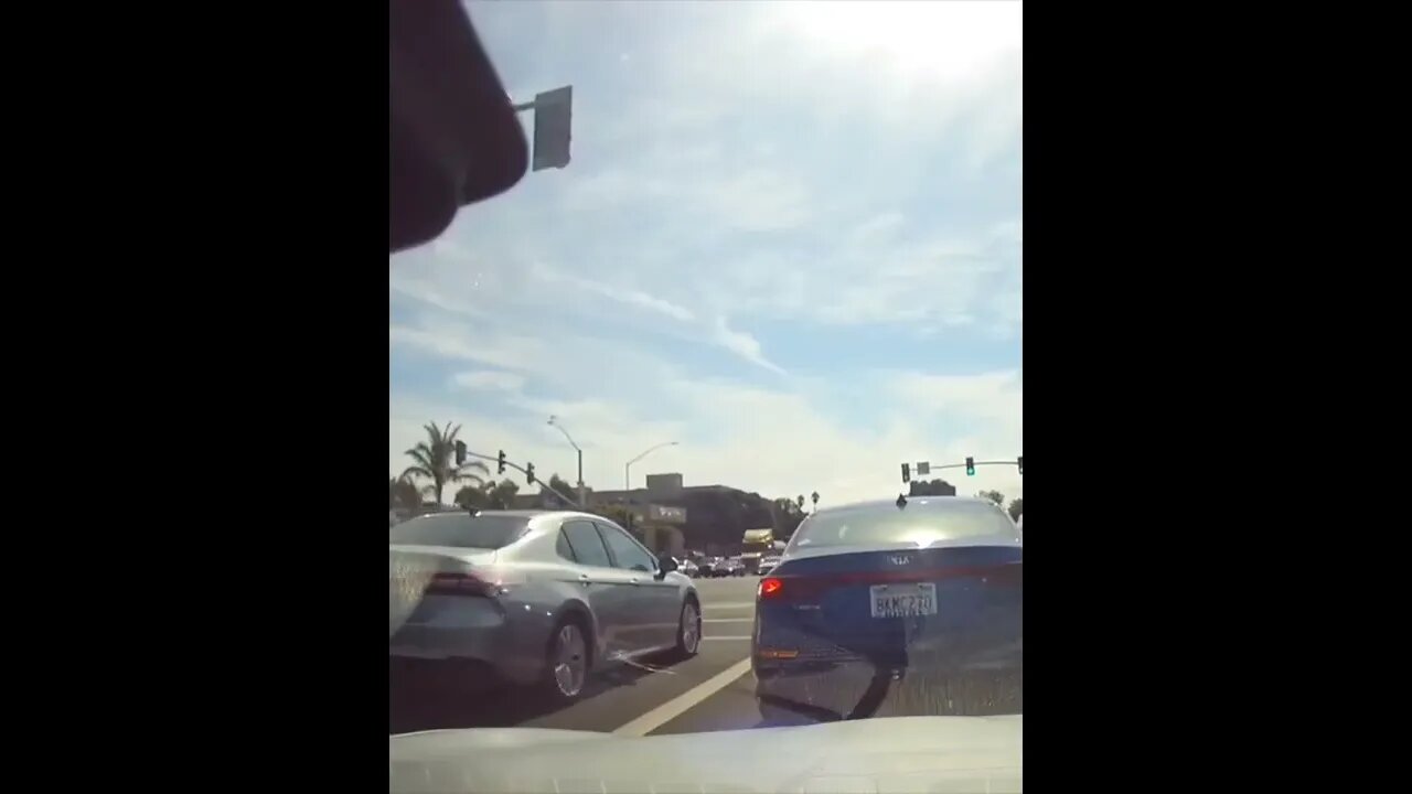 Pedestrian Walks In Front Of Traffic