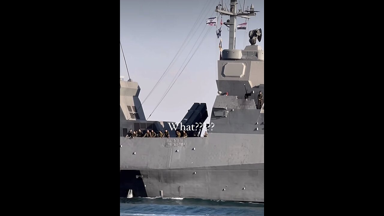 Israeli warship crossing the Suez Canal flying both the Israeli & Egyptian flags.