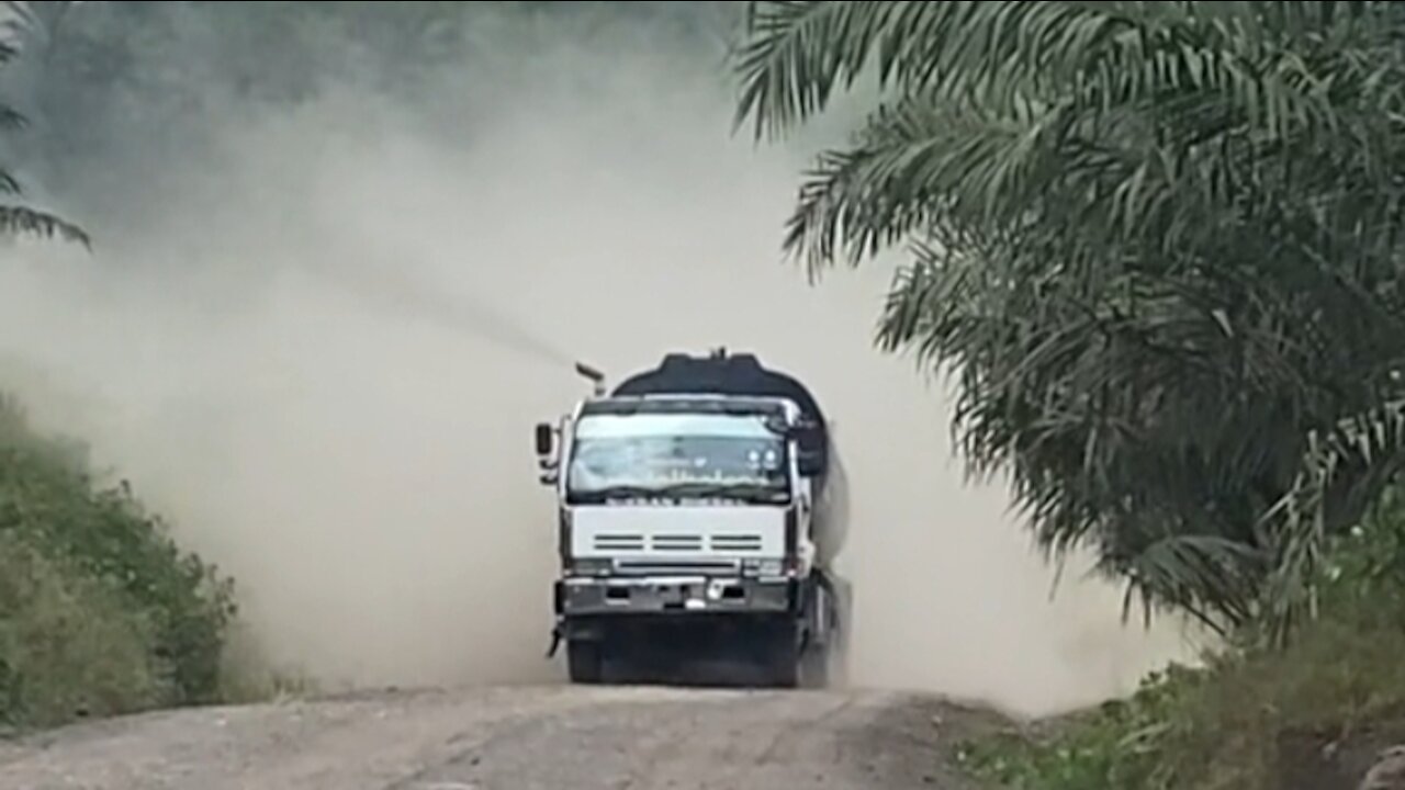 The truck steps on the gas until there is a lot of smoke