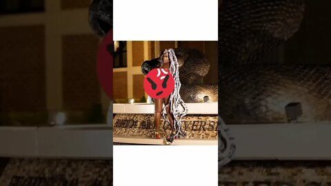Educated woman gets naked and has a wig made of snakes for her wig for her graduation pictures? why