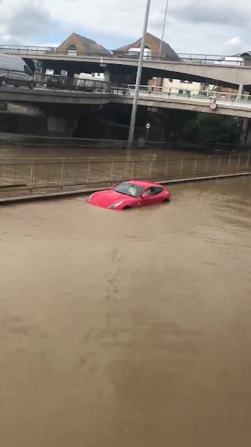 Eight people rescued after burst water main floods London road