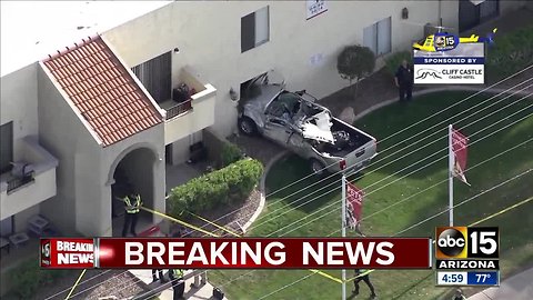 Truck crashes into building in Mesa