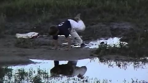 "Boy's Shoe Gets Stuck in Mud"