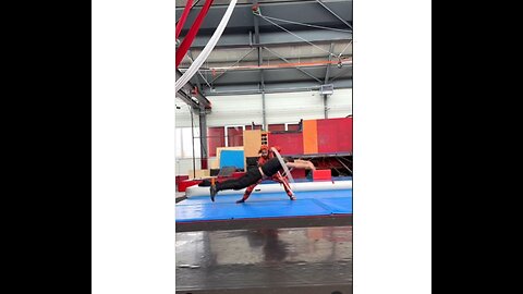 Amazing footage of a talented gymnatitist jumping up and down through hoops