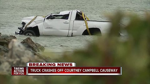 Truck crashes off Courtney Campbell Causeway