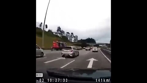 Motorcycle Causes Car to Wheelie On The Freeway!