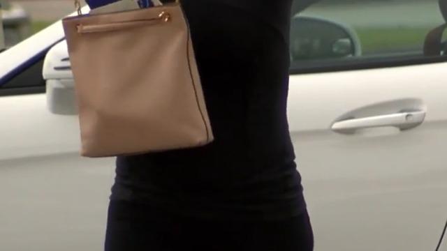 Woman says across the body purse saved her life