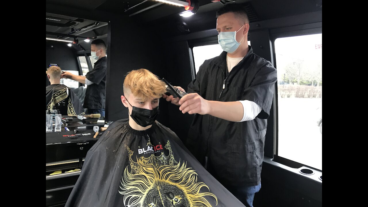 Kenosha barber's unique way to stay open during pandemic