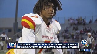 Vigil held for Deerfield Beach High School football star killed by train