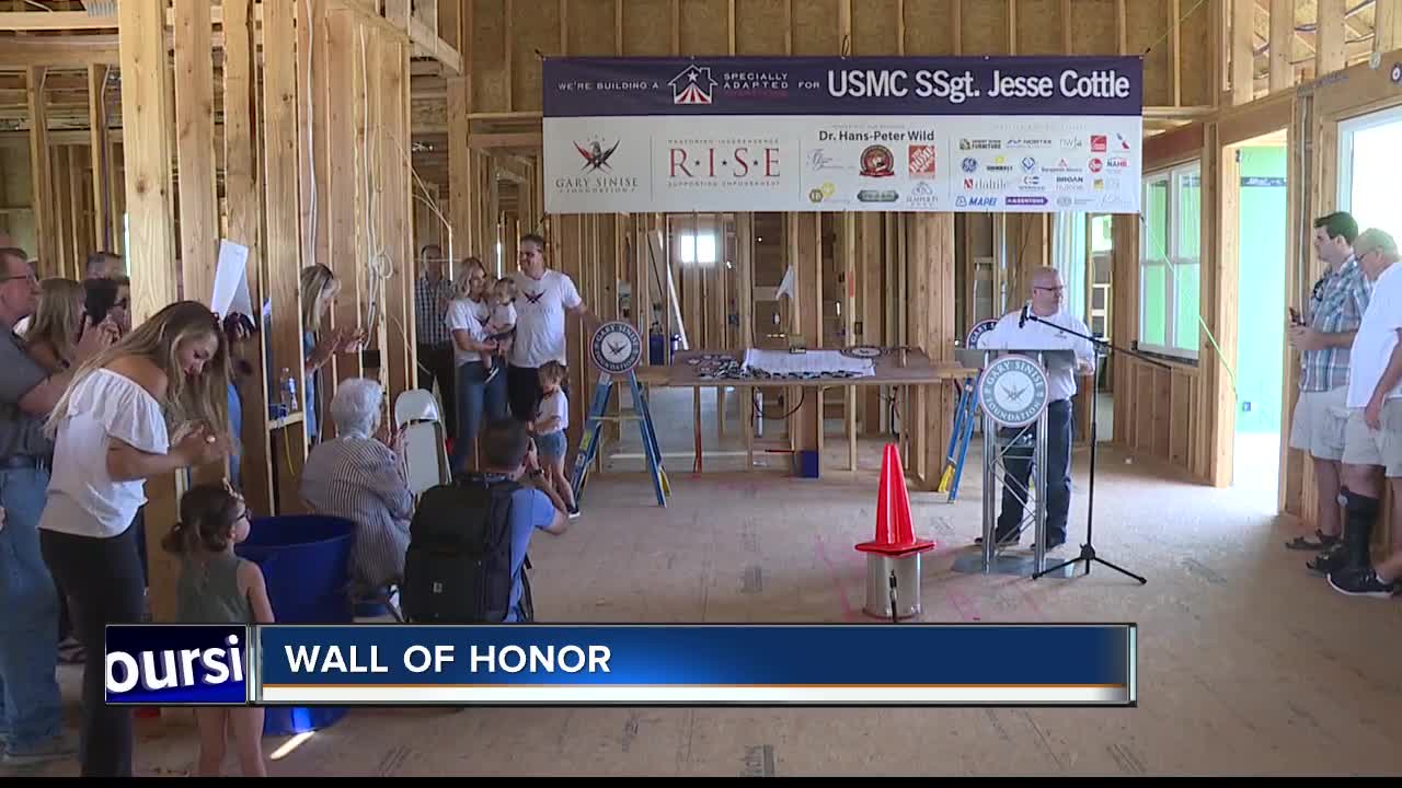 Community writes messages of encouragement on walls of local veteran's new smart home