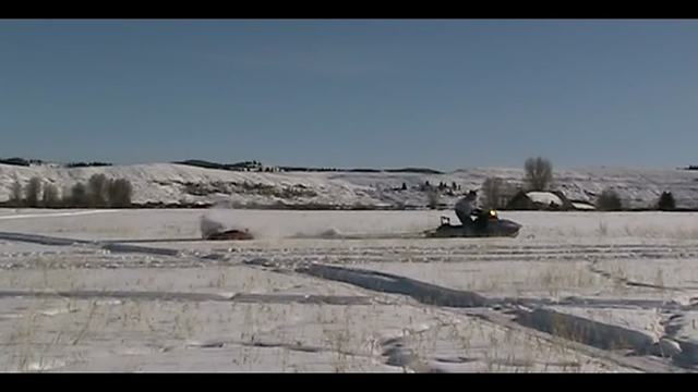 "Snowmobile Fail: Little Boy Gets Covered in Snow"