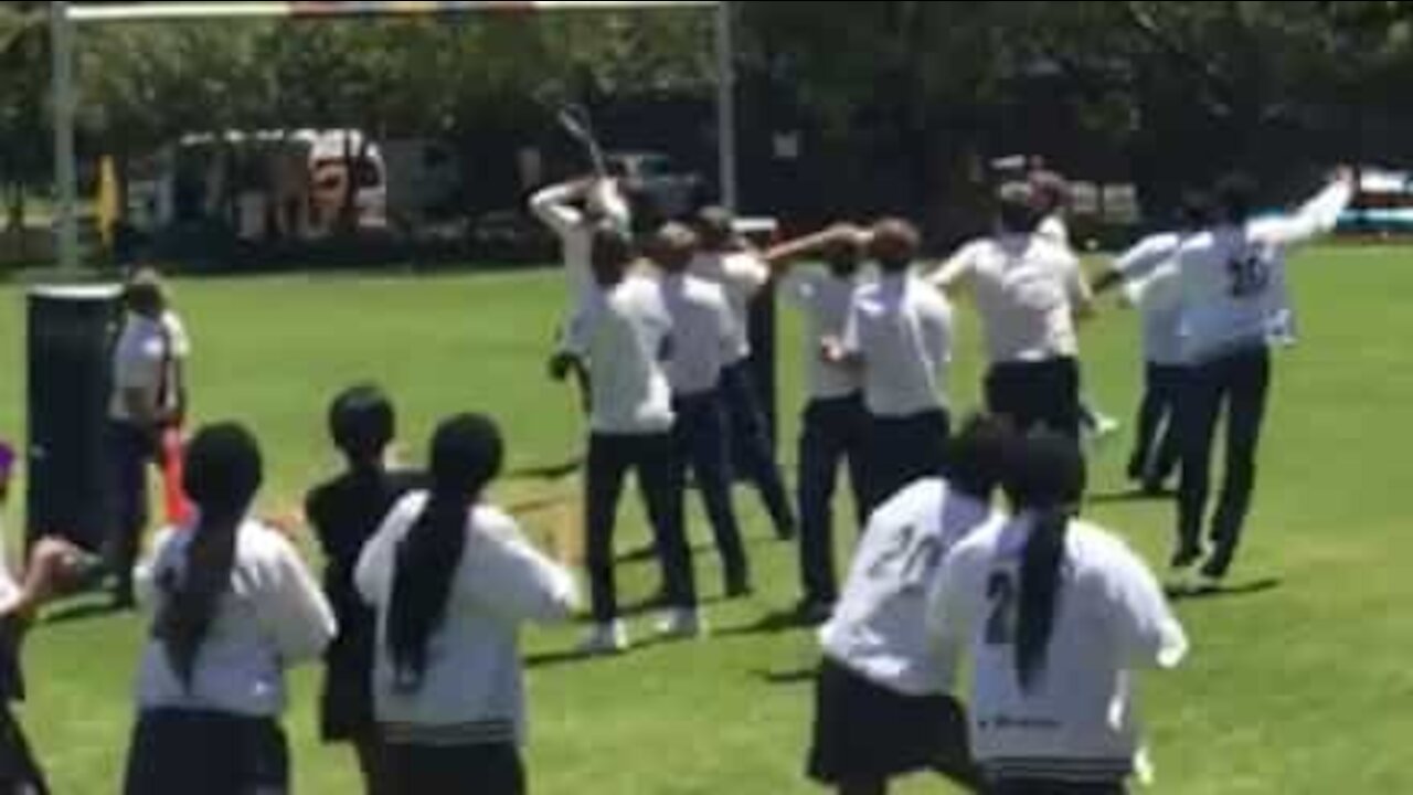 Kid throws traffic cone on top of rugby post