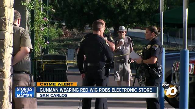 Gunman wearing red wig robs electronic store