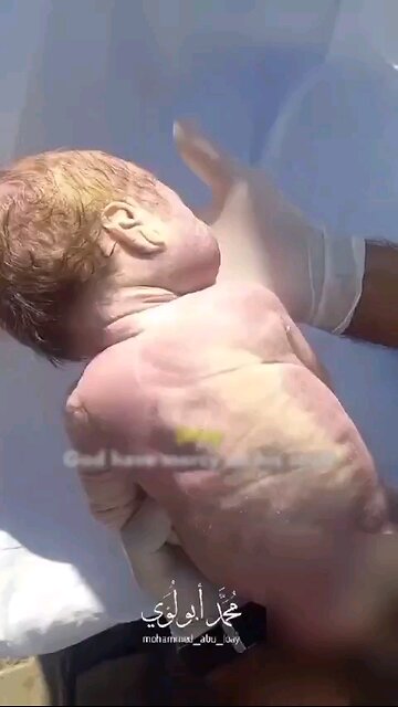 ‏Footage from Beit Lahia shows a newborn baby who suffocated under da rubble of a bombarded building