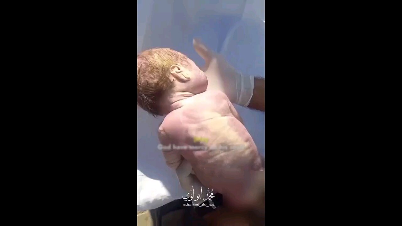 ‏Footage from Beit Lahia shows a newborn baby who suffocated under da rubble of a bombarded building