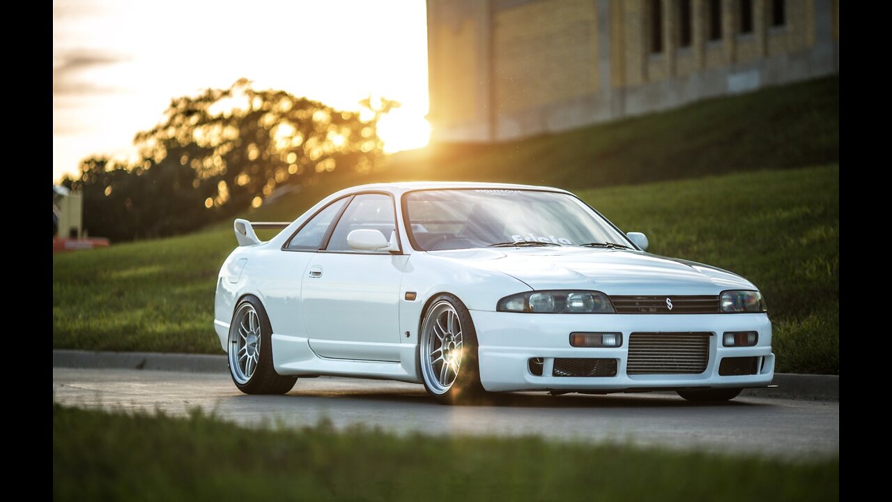 White Nissan Skyline GTR R 33 on the road