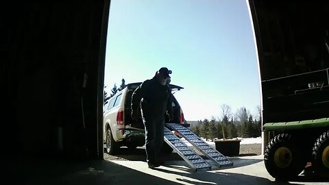 Unloading the generator from bed of truck