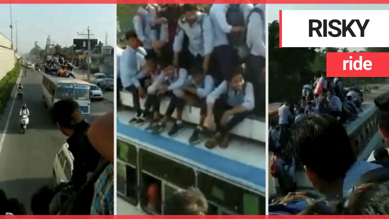 Worrying footage shows kids taking the bus to school - by sitting on the roof