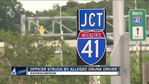 Officer hit by alleged drunk driver while assisting on a crash on I-41