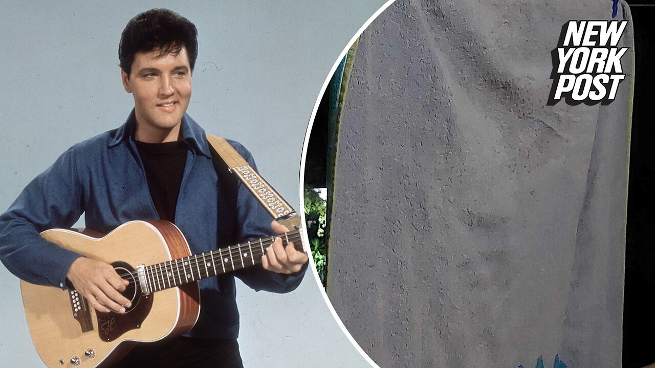 Couple spots face of Elvis on beach towel