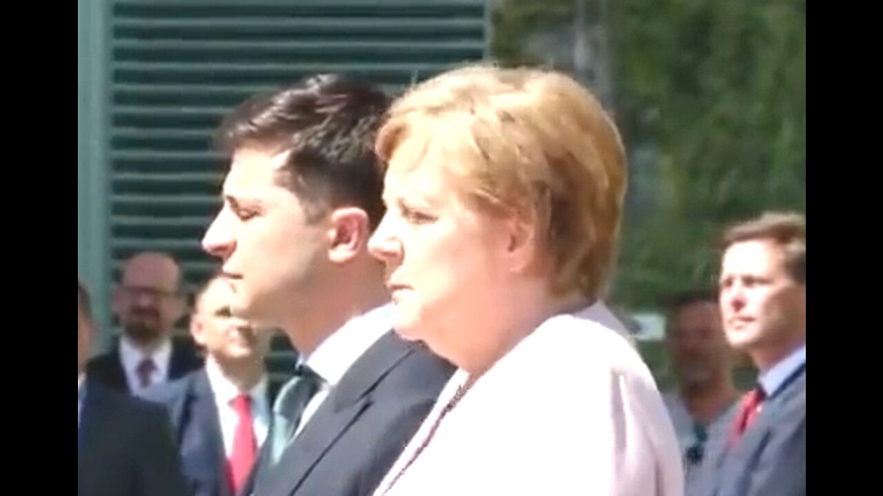 German chancellor Merkel keeps trembling when the national anthem is played, 2019