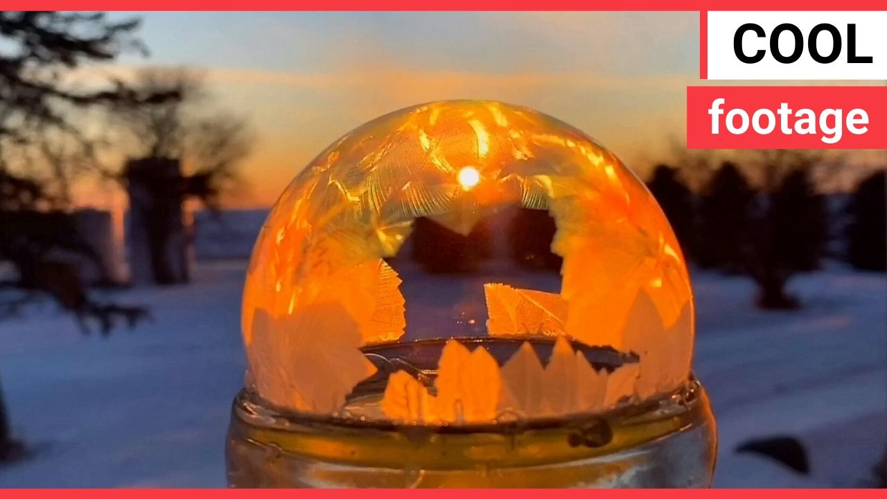 Icy conditions cause a water ball to instantly freeze in a mesmerising pattern