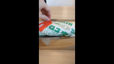 unwrapping this subway sub that I have ordered selectively