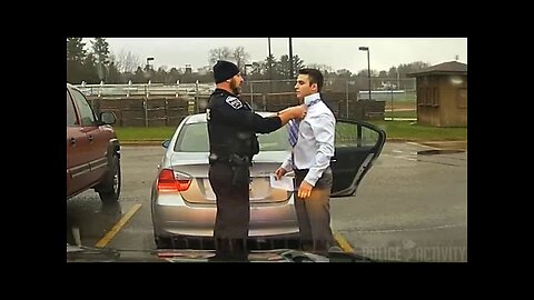Dashcam: Police Officer Helps Speeding Student Tie His Tie