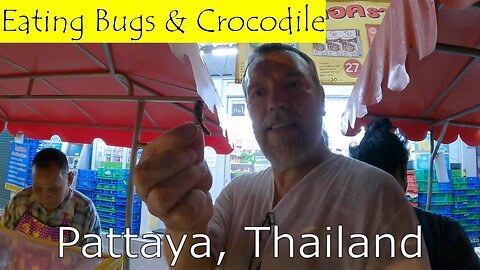 Eating Bugs and Crocodile. Airport Beach (Phuket, Thailand)