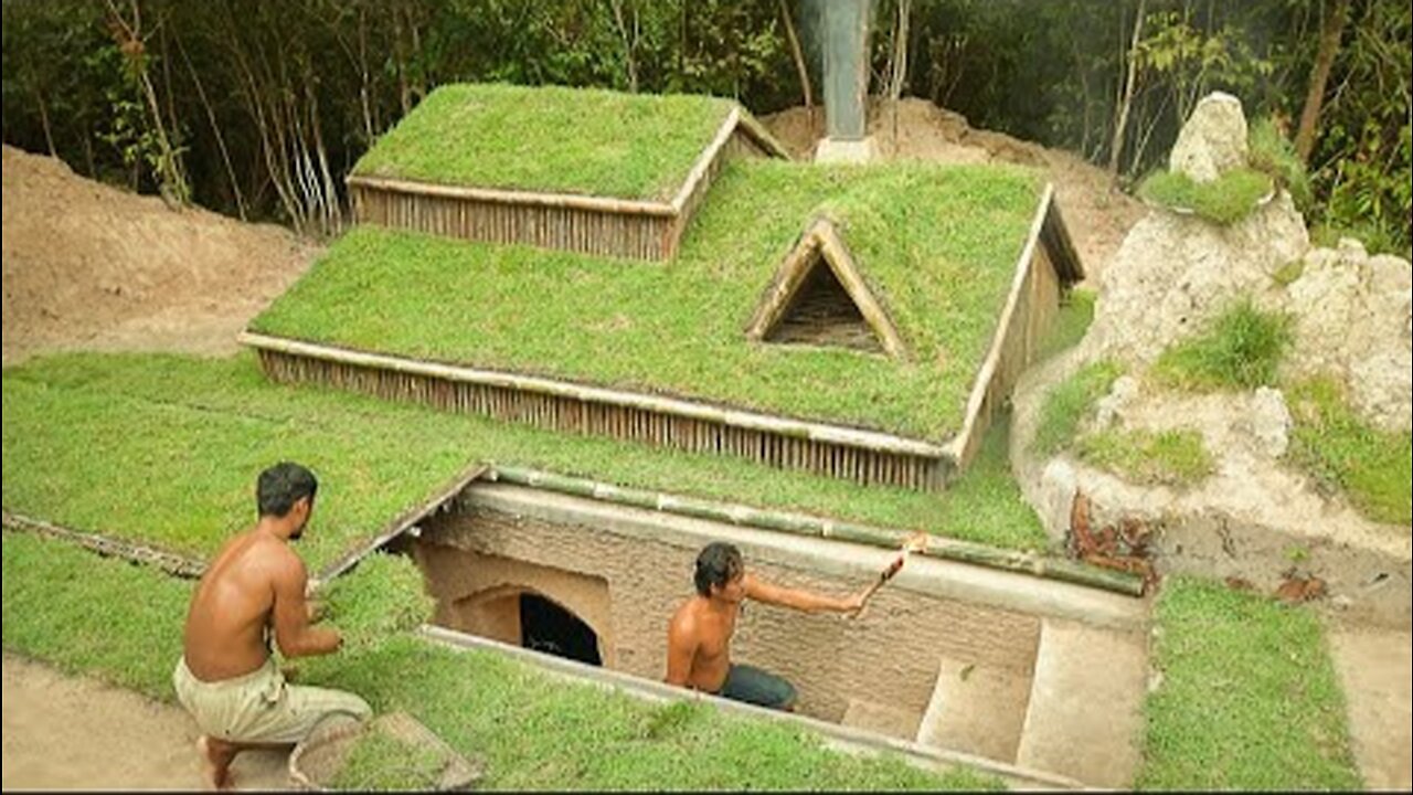 Building underground hut with grass roof & fireplace with clay