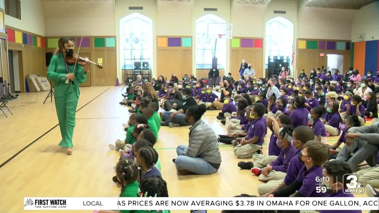 Nebraska-born violin star Ezinma plays for students at Nelson Mandela Elementary