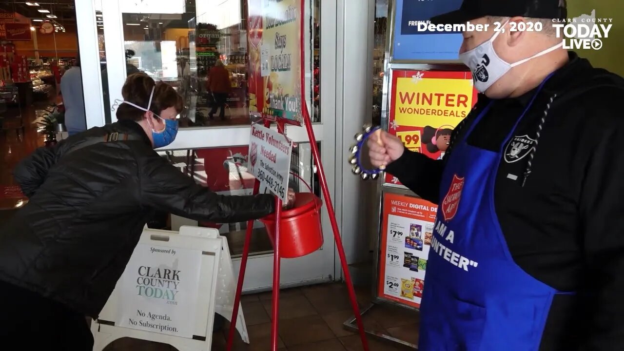 Clark County Today staff members ring the bell for Salvation Army