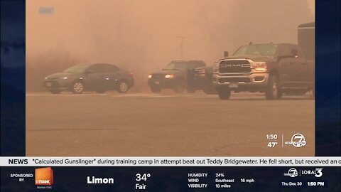 Smoke from nearby wildfires fills the air in Louisville