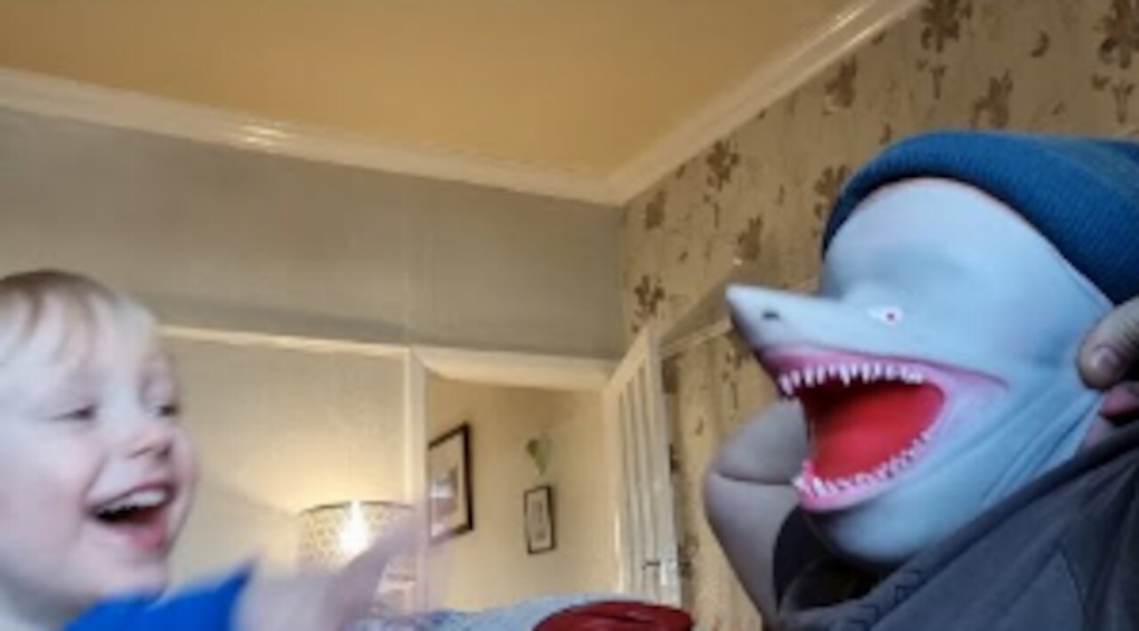 Father Wears Shark Mask On Face To Play With Son