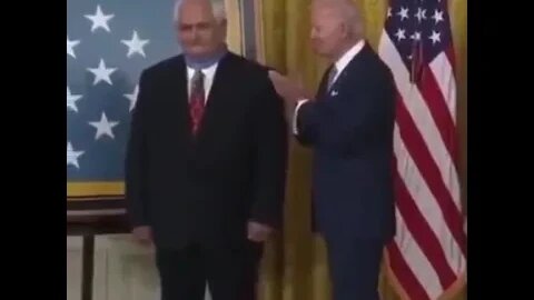 Biden puts the medal on backwards.🤦