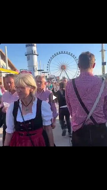 A migrant walks through Oktoberfest in Germany groping random women...