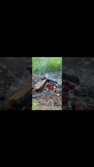 Glowing embers in a camp fire