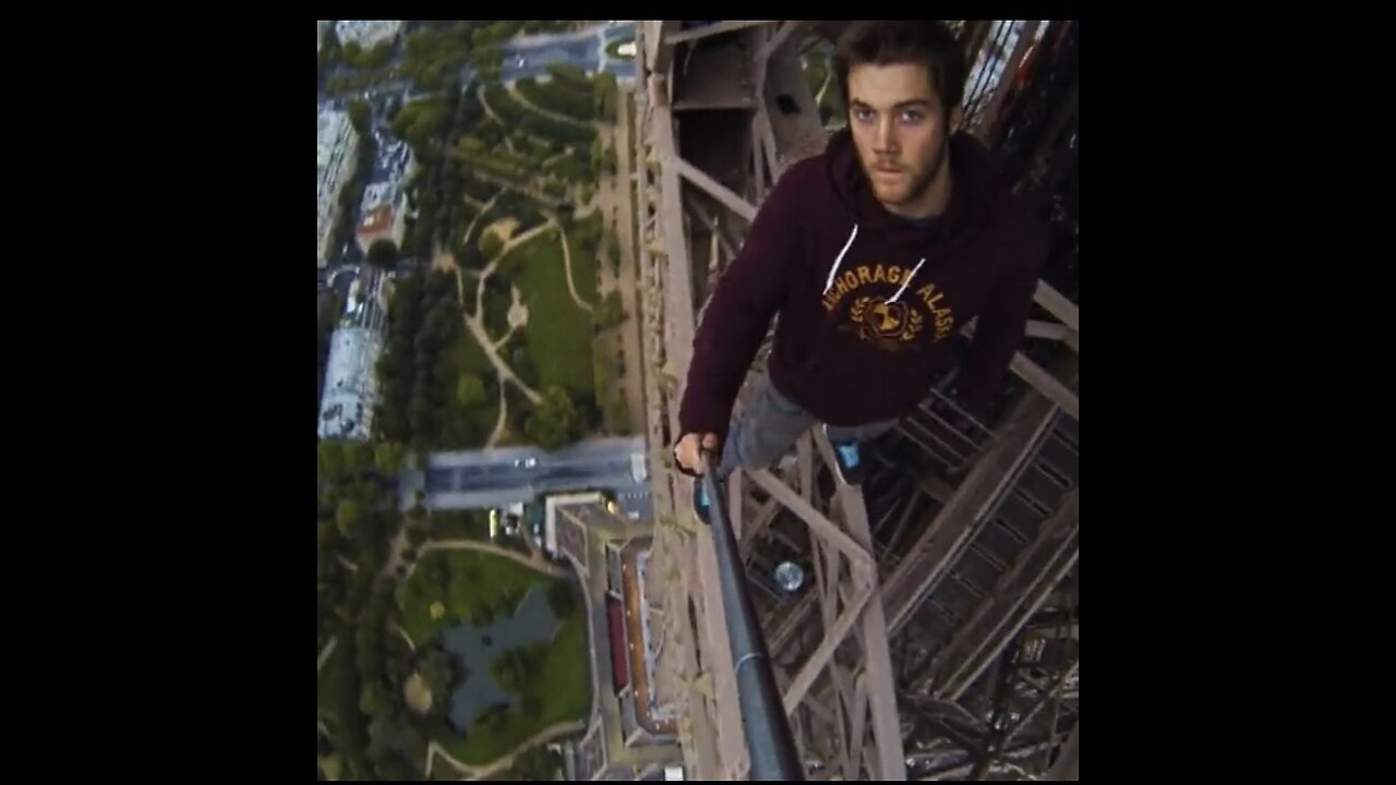 A boys climbs the EIFFEL TOWER😯