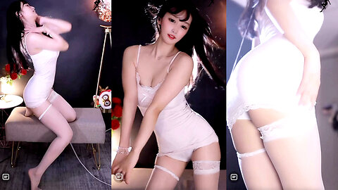 Alluring dance streamer in a white strapless dress and thigh-high stockings, performing bold chest and hip moves