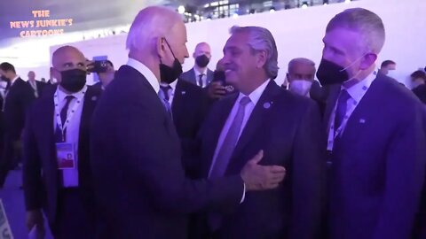 Biden pulls down his mask to get close and talk to Argentinian president.