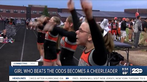 Girl who beats the odds becomes a cheerleader