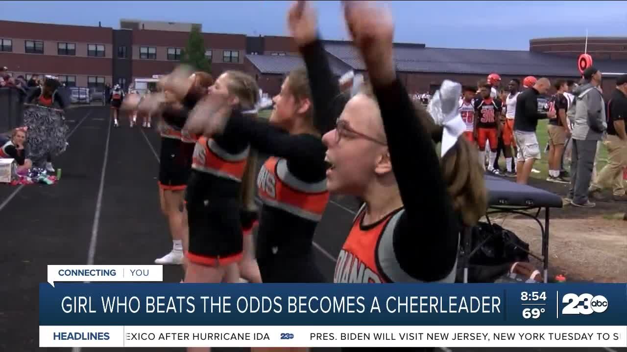 Girl who beats the odds becomes a cheerleader