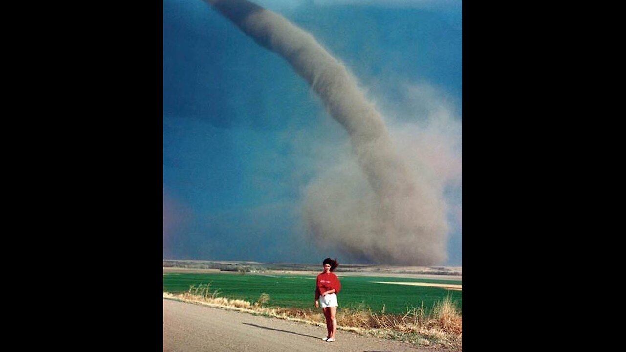 Nebraska girl, Audra Thomas, photographed in front of a tornado, 1989.