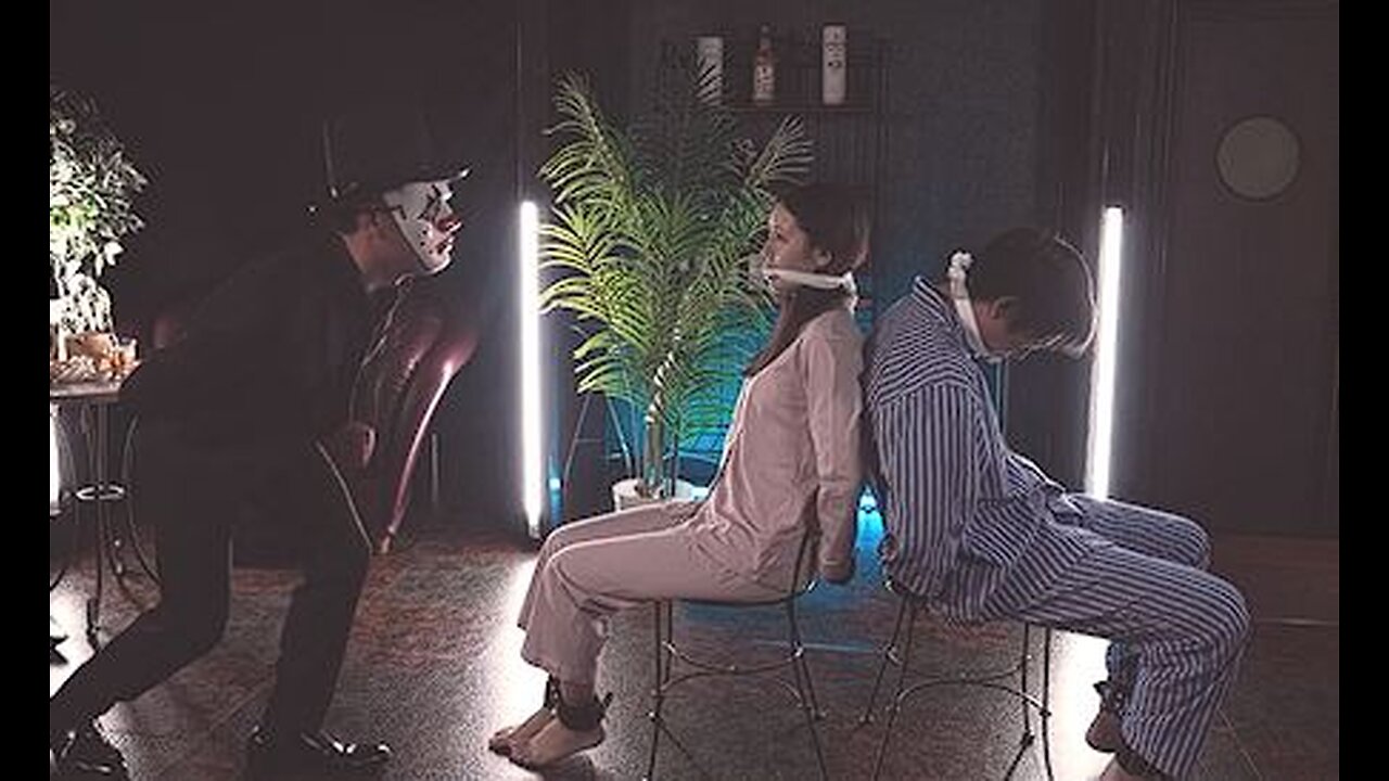 Wife is forced to participate in a Death Game to save her Husband