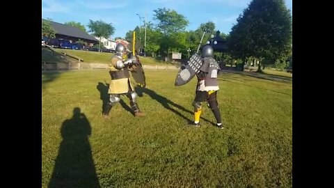 Tsafa Fighting in Yellow with Sword and Shield